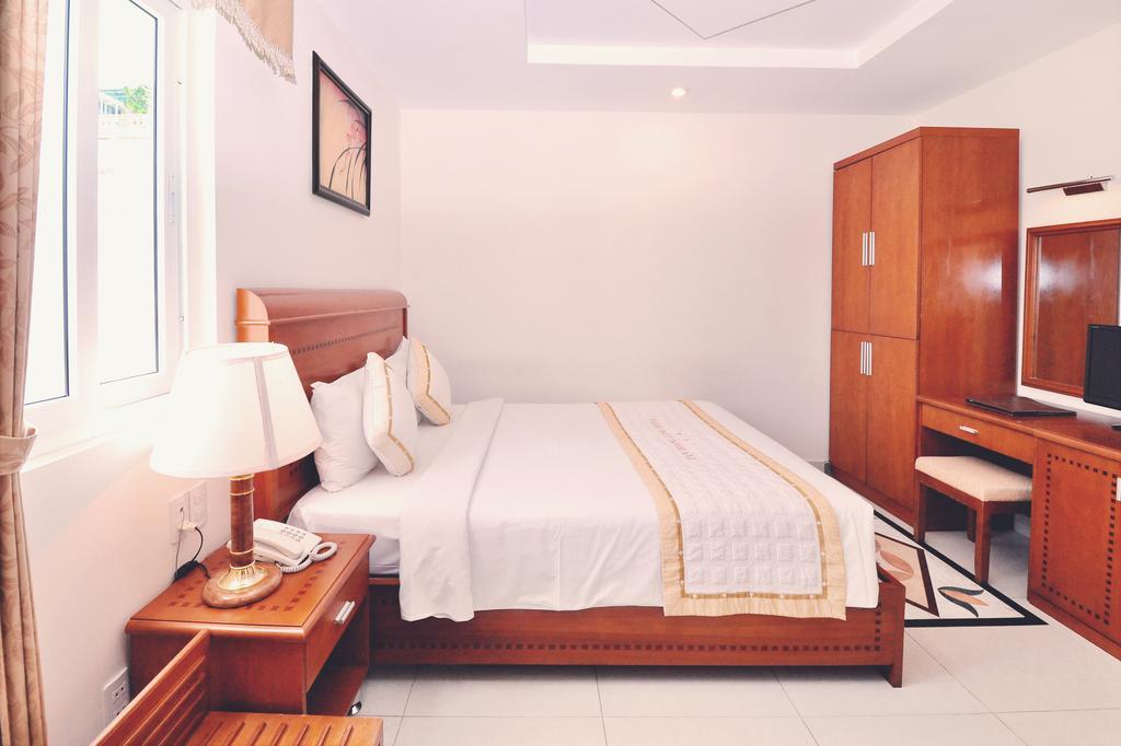 Tan Hoang Long Hotel Cidade de Ho Chi Minh Quarto foto